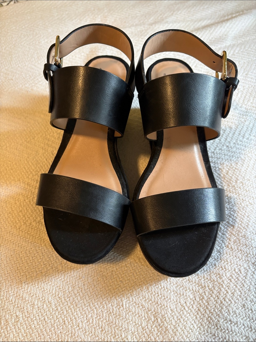 Black platform sandals with gold buckle